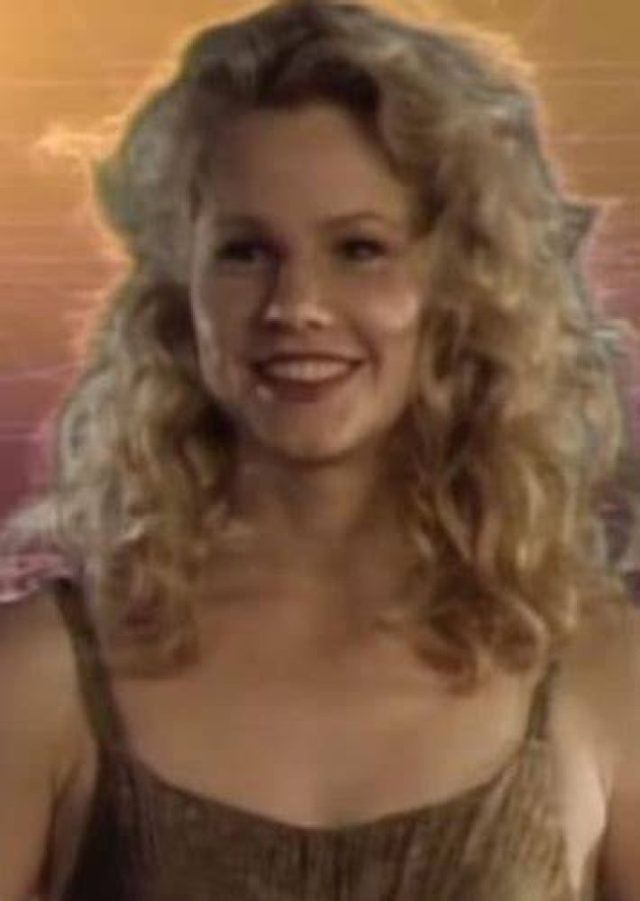 Diana Powers on a virtual reality backdrop.